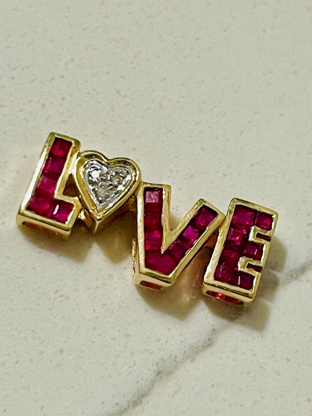 Diamond ruby pink sapphire LOVE pendant yellow gold